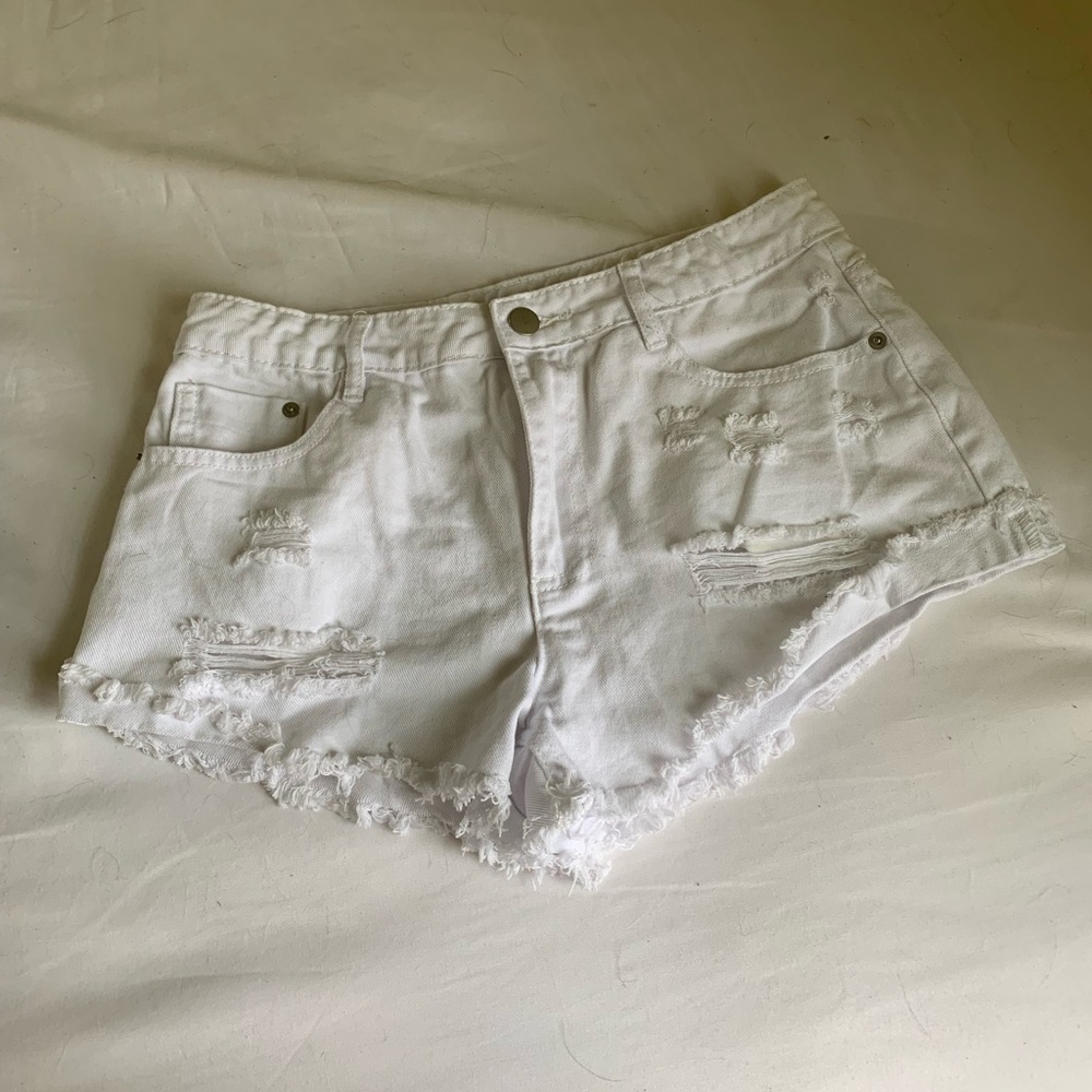 Ripped white shorts